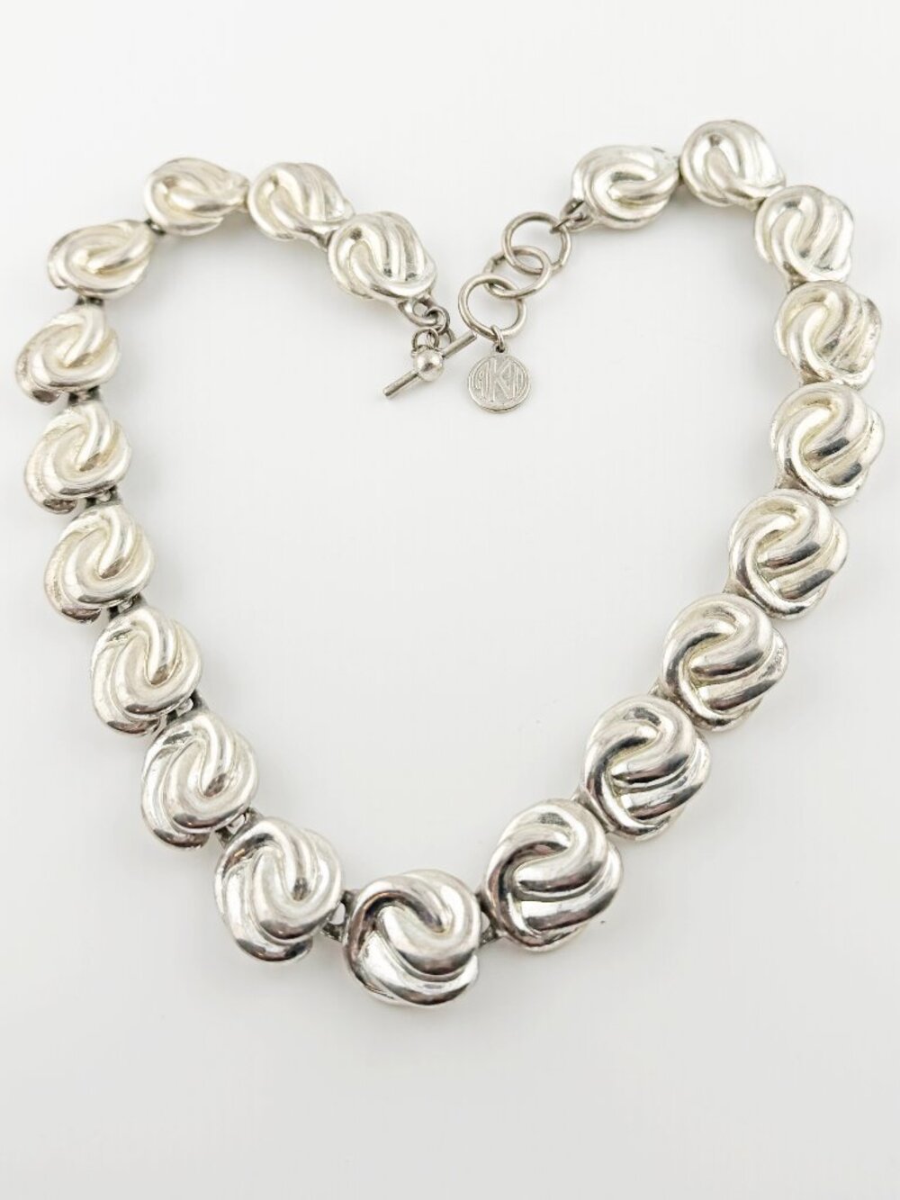 Anne Klein AKII Silver Tone Vintage Swirl Knot Statement Necklace Modernist